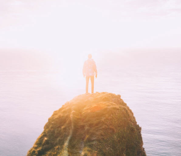 Who am I? Explorer on a rock above the ocean. Blog article by RebeccaRoberts.com